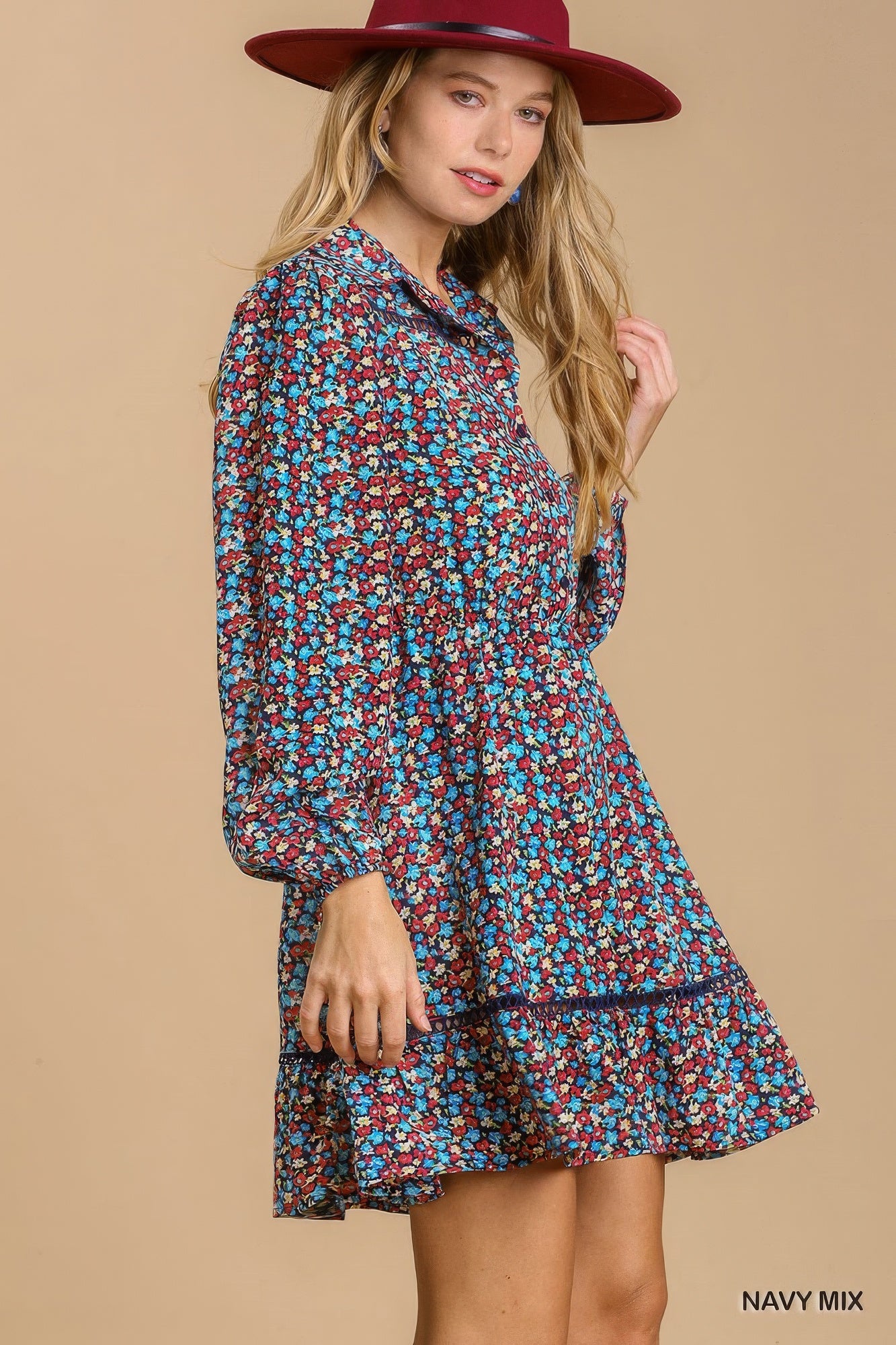 Navy floral collared button-down dress with long puff sleeves and tiered ruffle hem