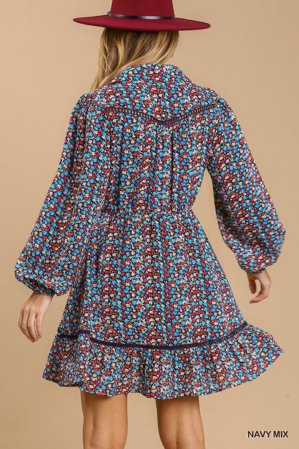 Back view of navy floral collared button-down mini dress with tiered ruffle hem