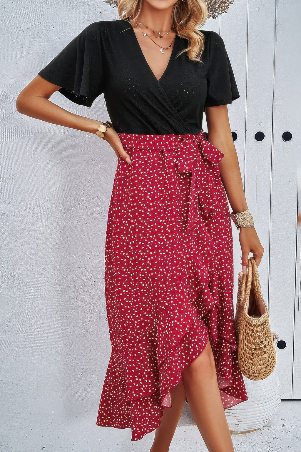 Wine red dot-print skirt with black V-neck wrap bodice and tied waist detail