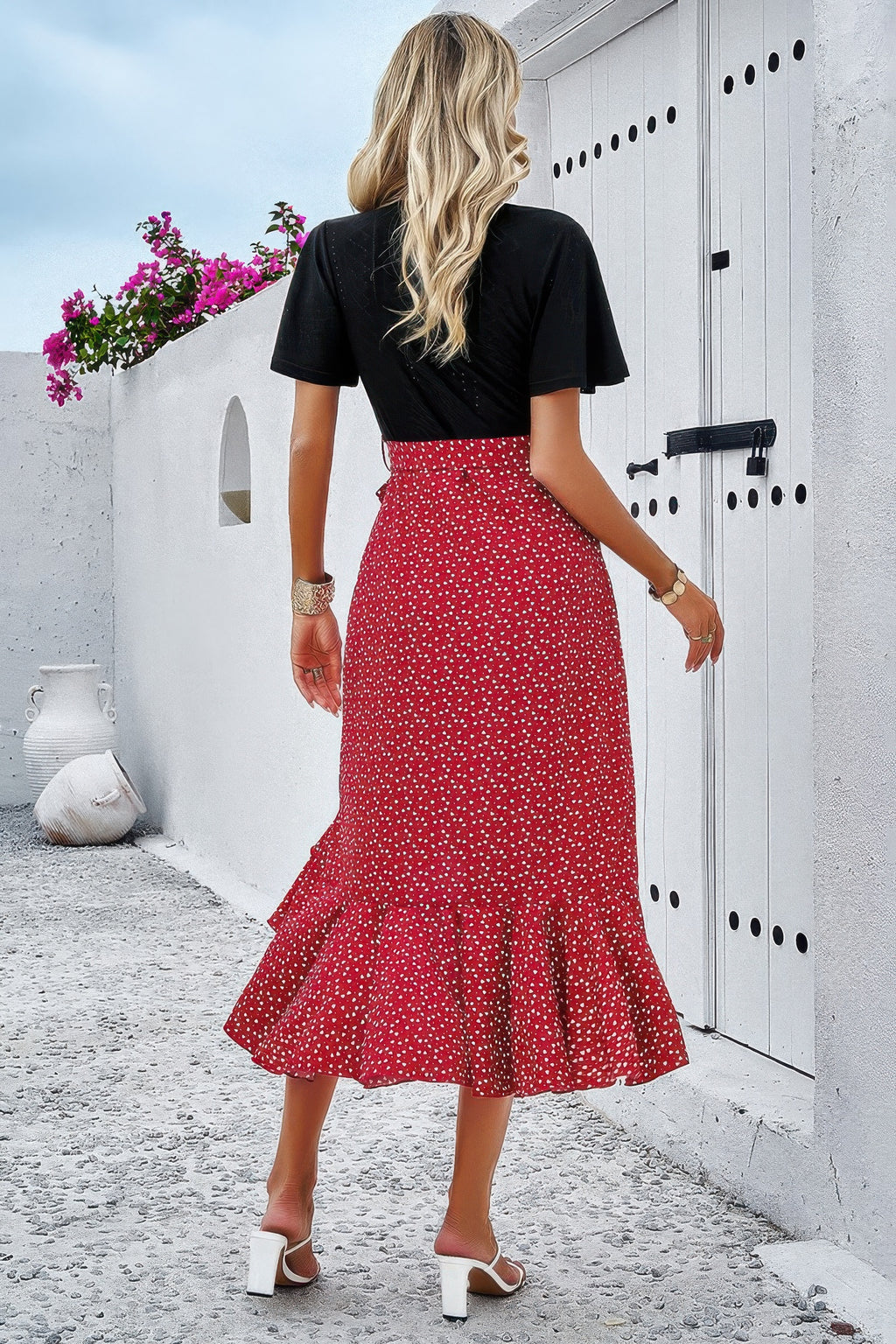 Back view: black short-sleeve V-neck bodice with wine red dot-print midi skirt