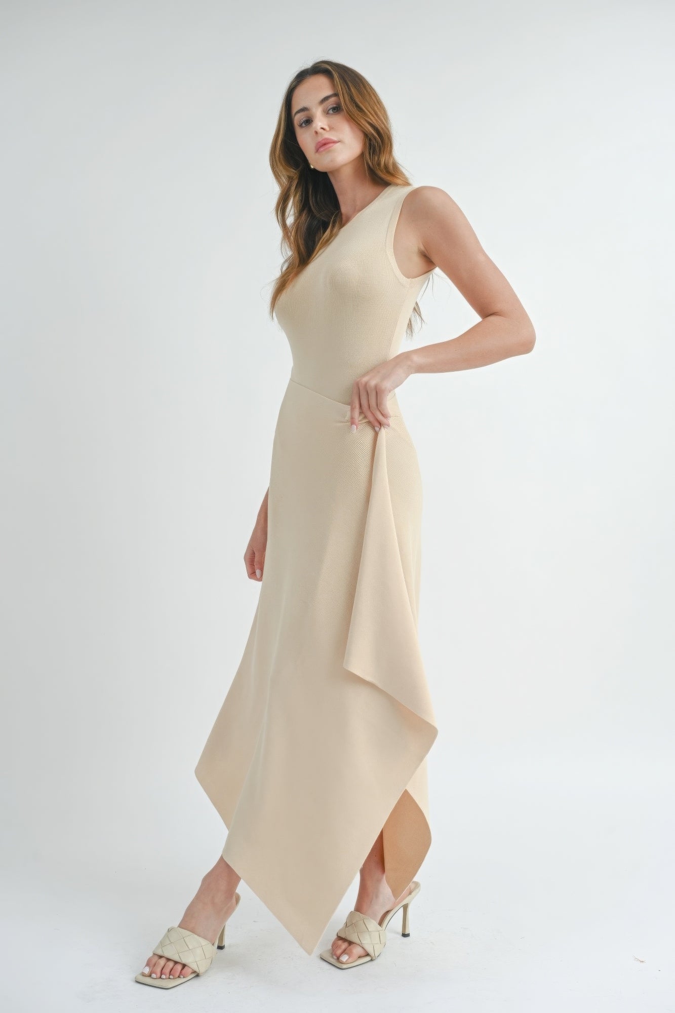 Natural beige sleeveless maxi dress, side slit with flowing drape at hem