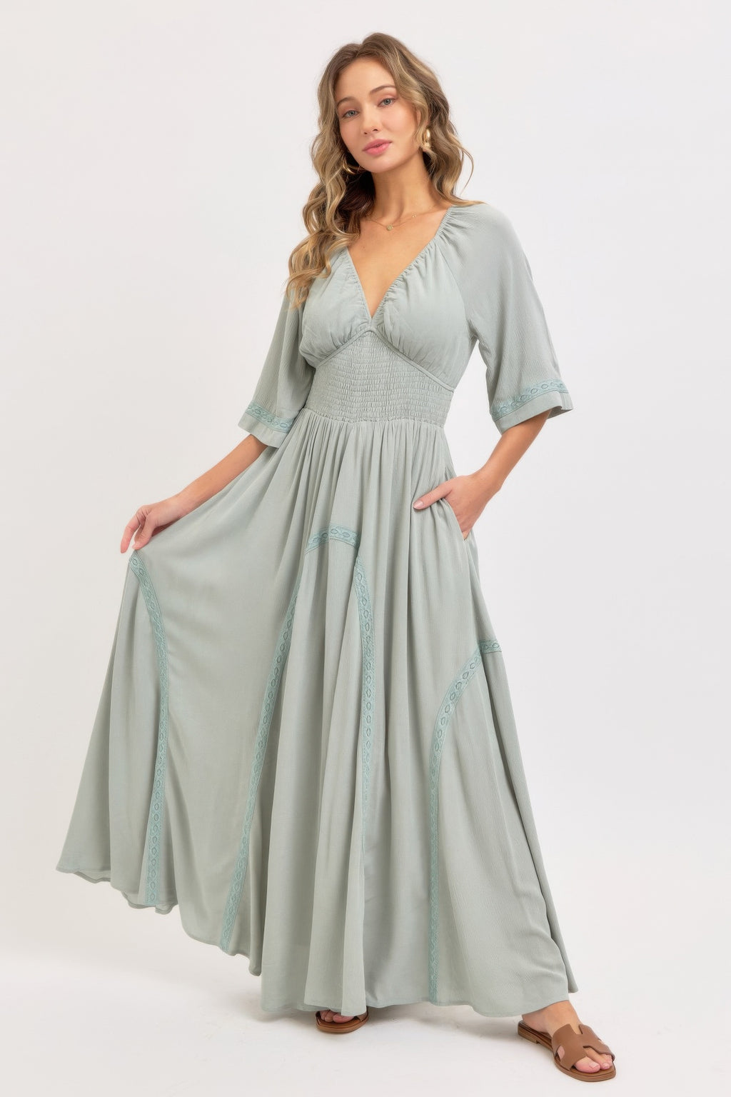 Romantic flowy maxi dress in dusty sage with V-neck and three-quarter sleeves
