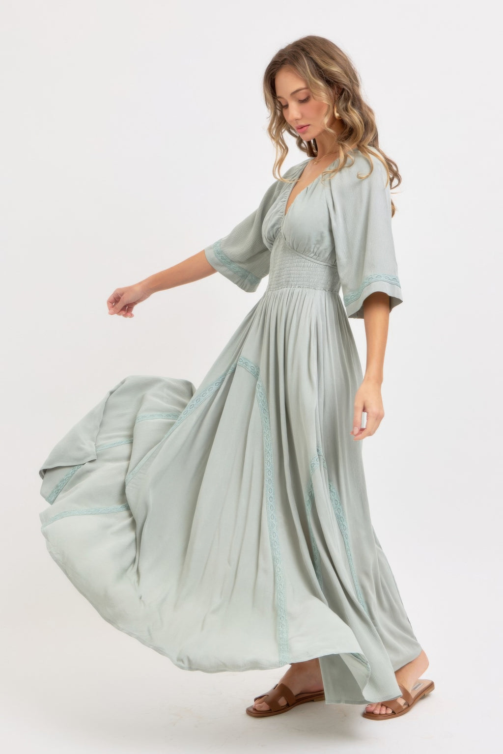 Dusty sage maxi dress with V-neck, gathered waist, and embroidered side panels