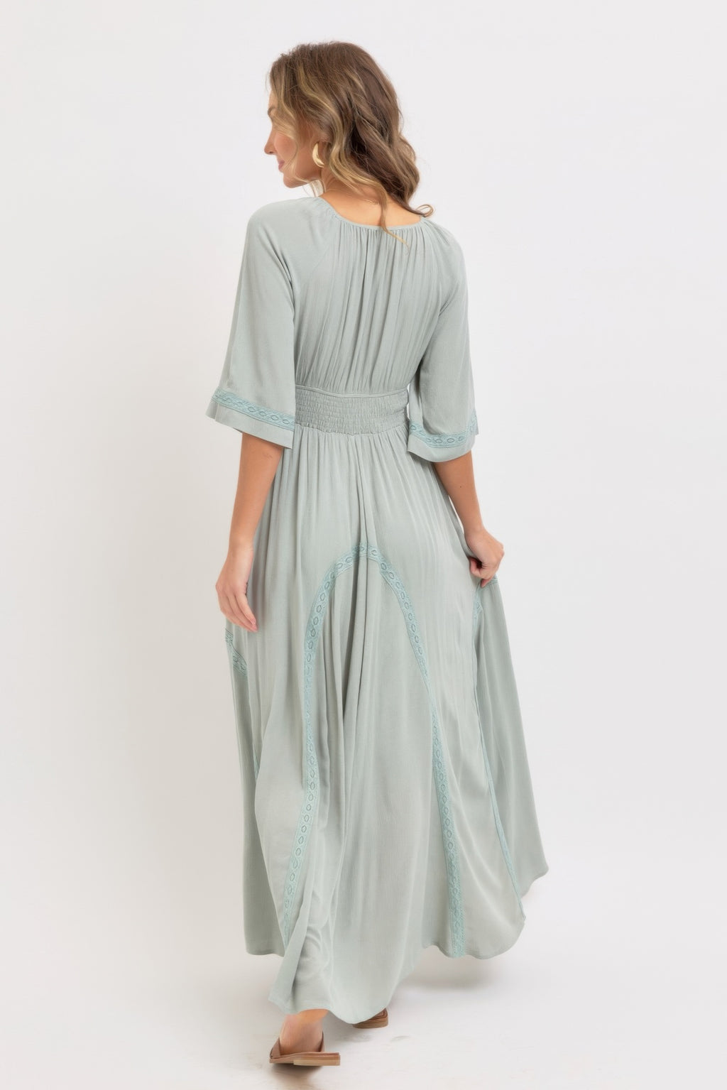 Dusty sage maxi dress back view with gathered waist and 3/4 sleeves