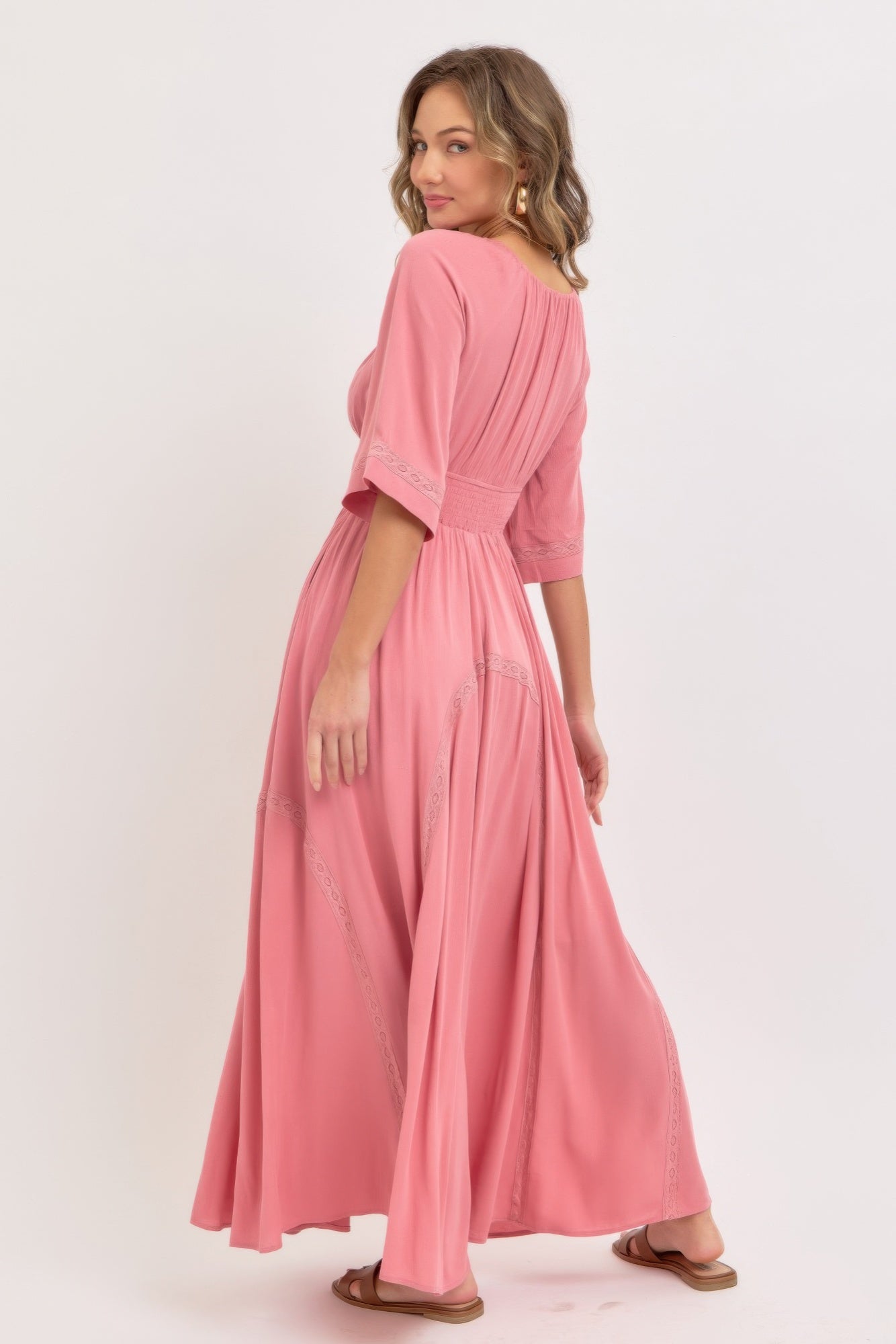 Pink rose maxi dress, side view with flowing skirt and embroidered lace hem