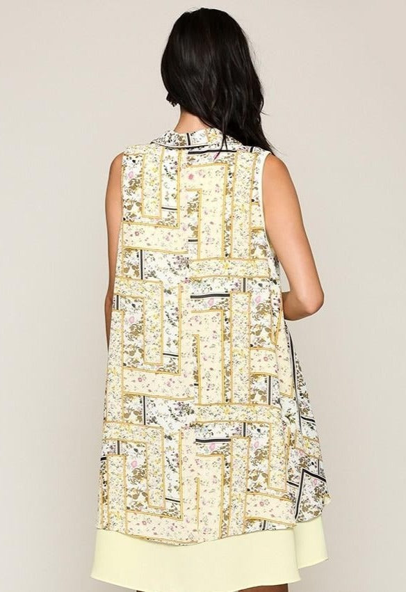 Back side of Yellow sleeveless collared printed dress, patchwork panels and hem