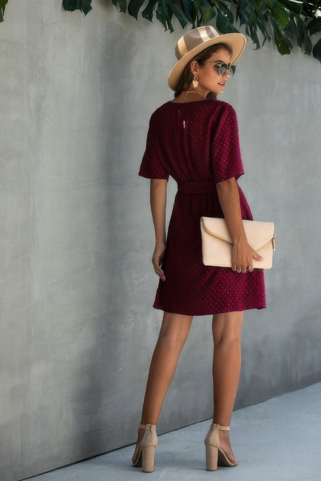V-neck wrap mini dress with ruffled hem, wine red with subtle speckles, tied waist