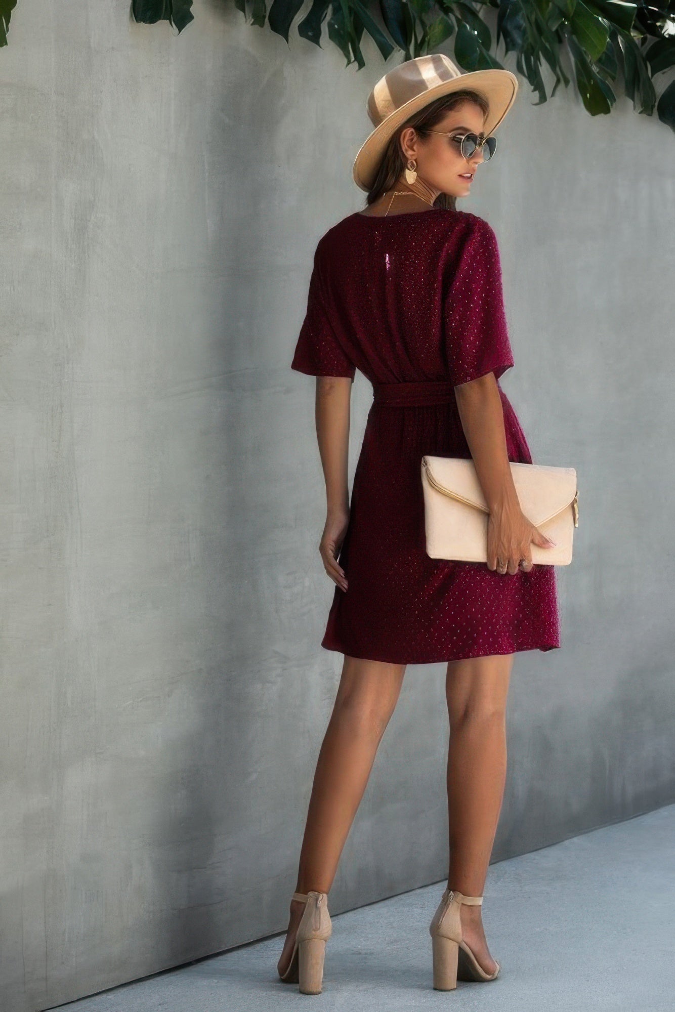 V-neck wrap mini dress with ruffled hem, wine red with subtle speckles, tied waist