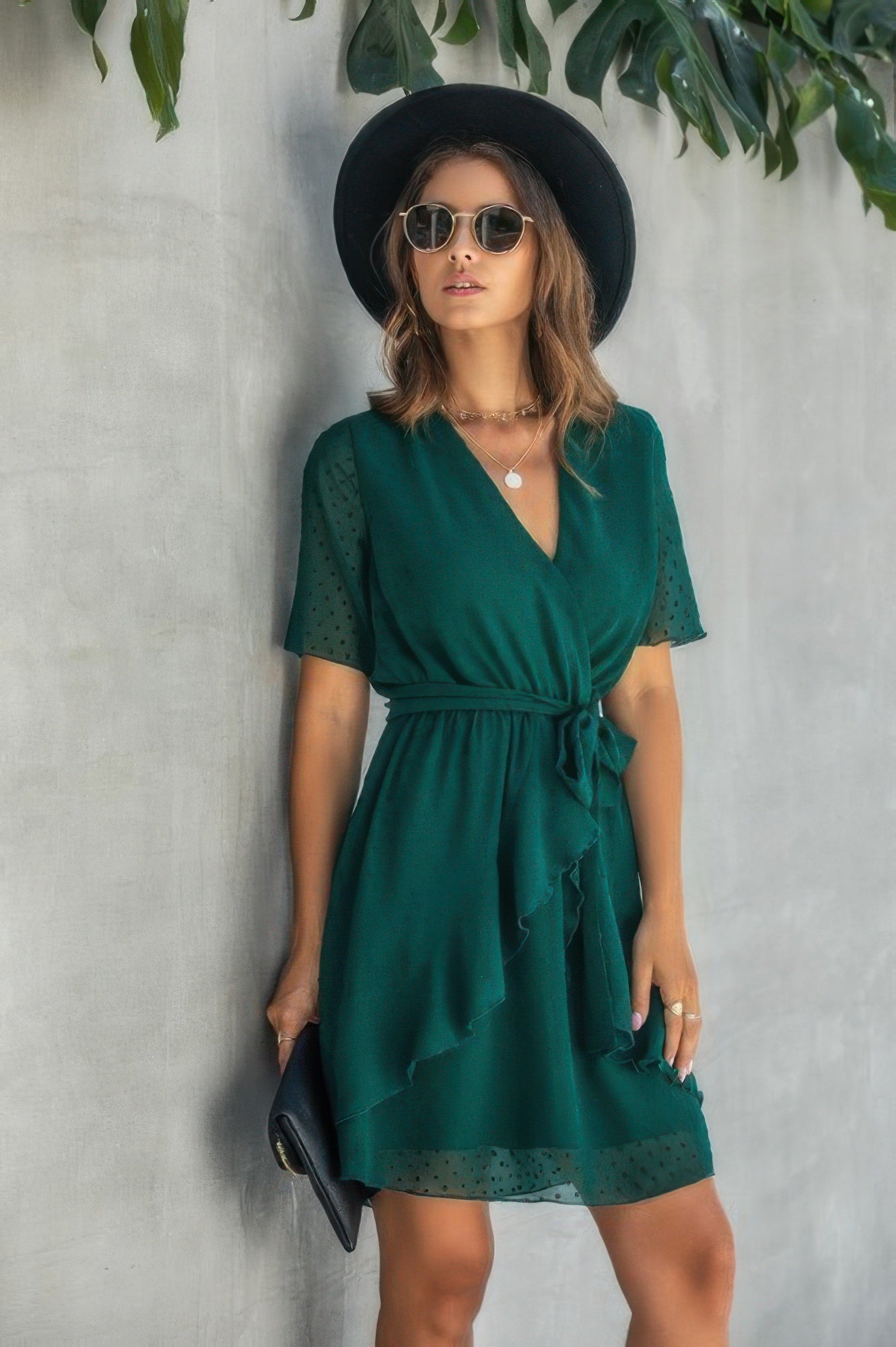 V-neck wrap mini dress with ruffled hem, deep green, short sleeves, tied waist
