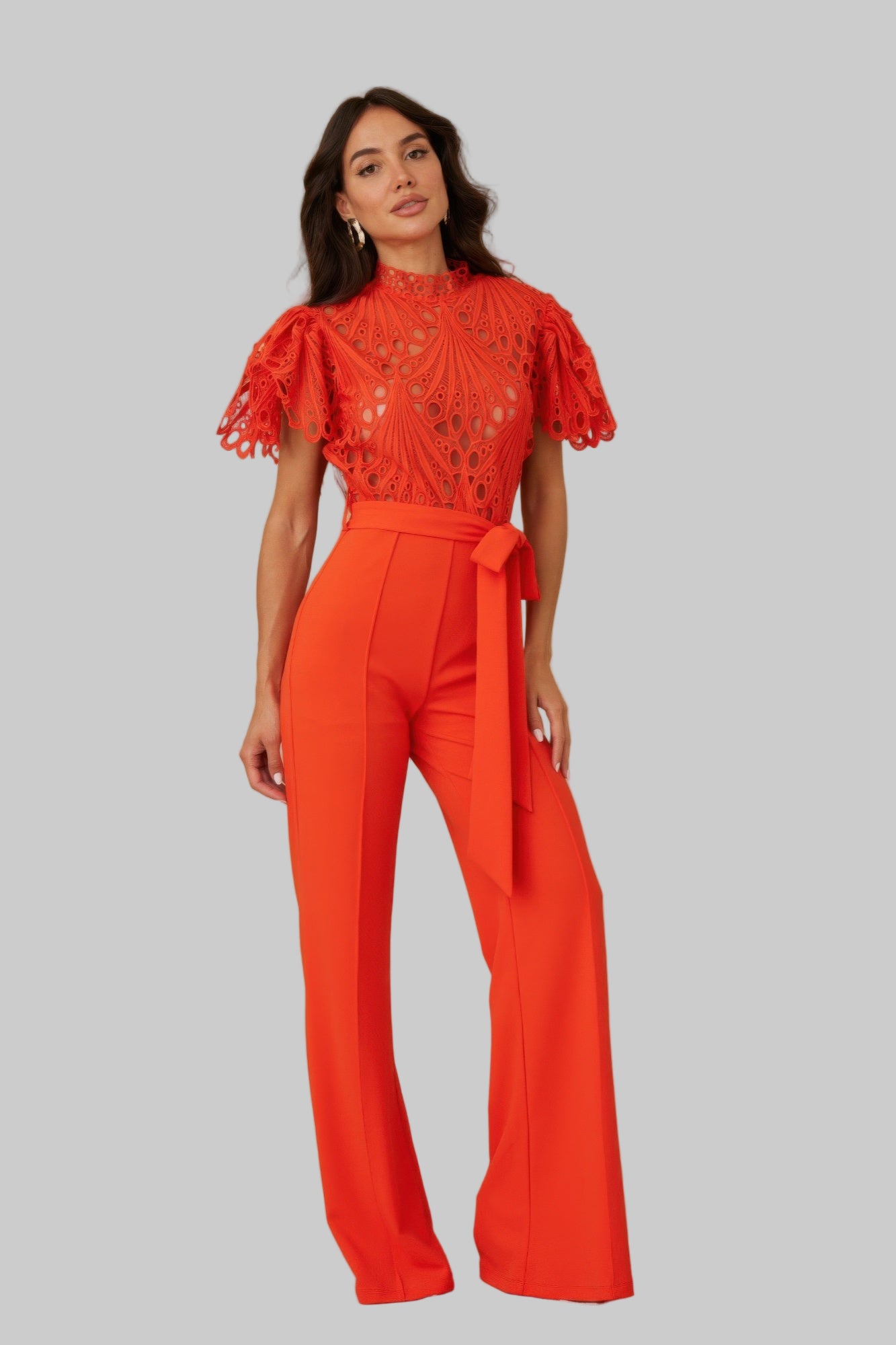 Orange crochet top jumpsuit with bow waist and wide-leg trousers