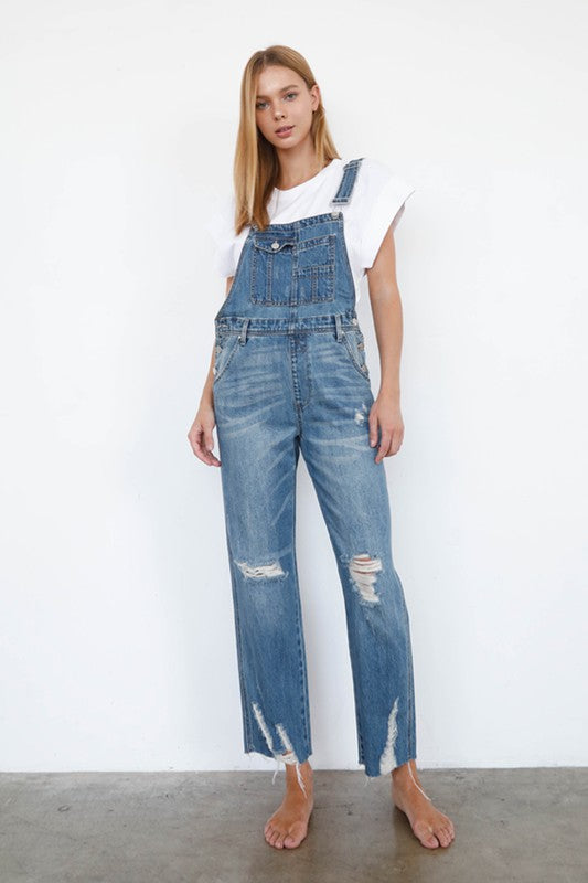 High waist ripped denim overall jumpsuit in medium wash, straight-leg with chest bib.