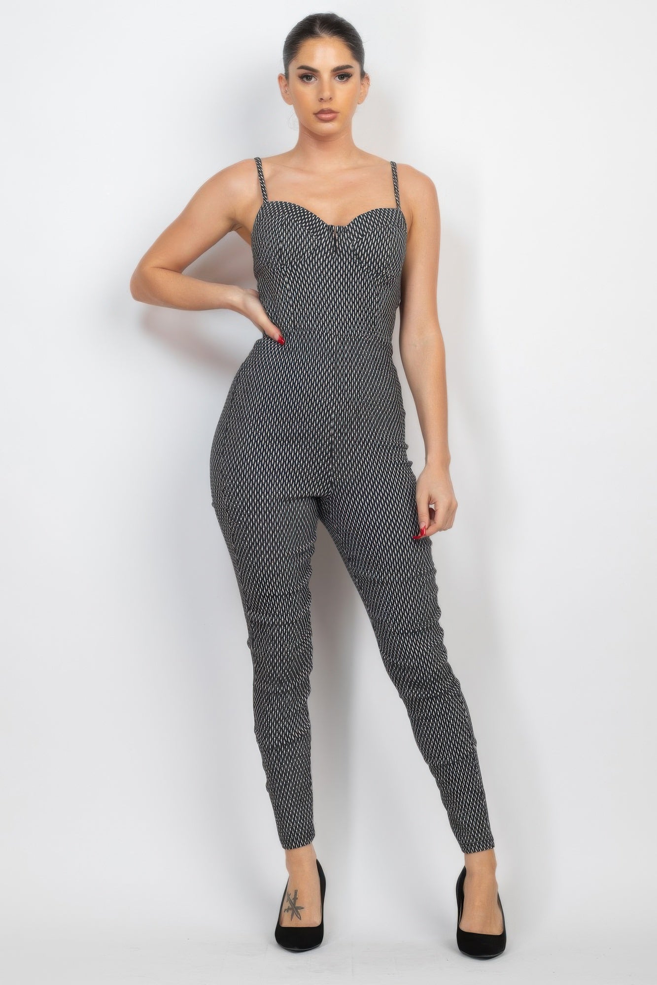 Black/white plaid sleeveless zip-front jumpsuit, full front view with slim legs