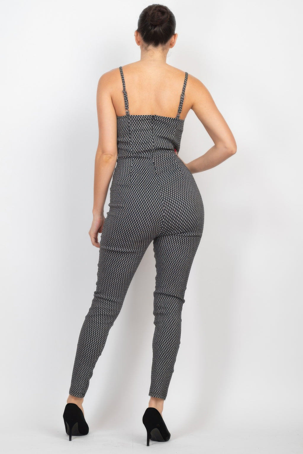Black/white plaid sleeveless zip-front jumpsuit, back view with narrow shoulder straps