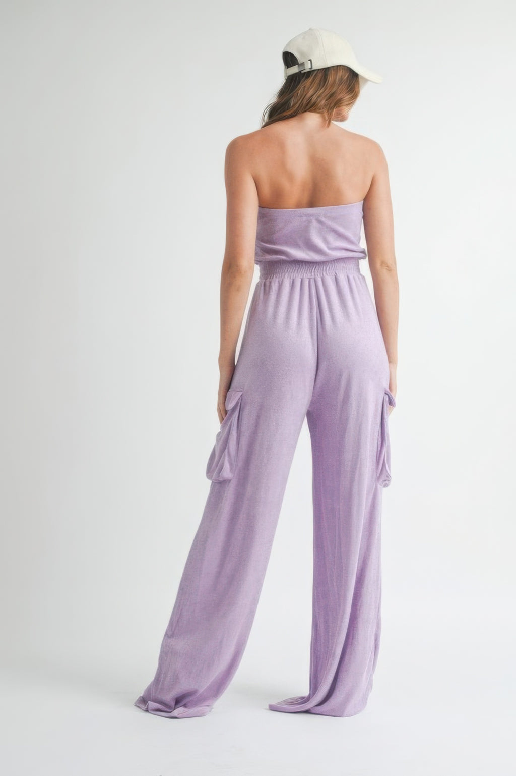 Lavender tube top jumpsuit shown from back, elastic waist with cargo pocket openings
