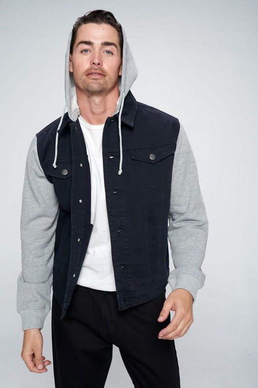 Black denim jacket with gray fleece hood and sleeves, buttoned chest pocket