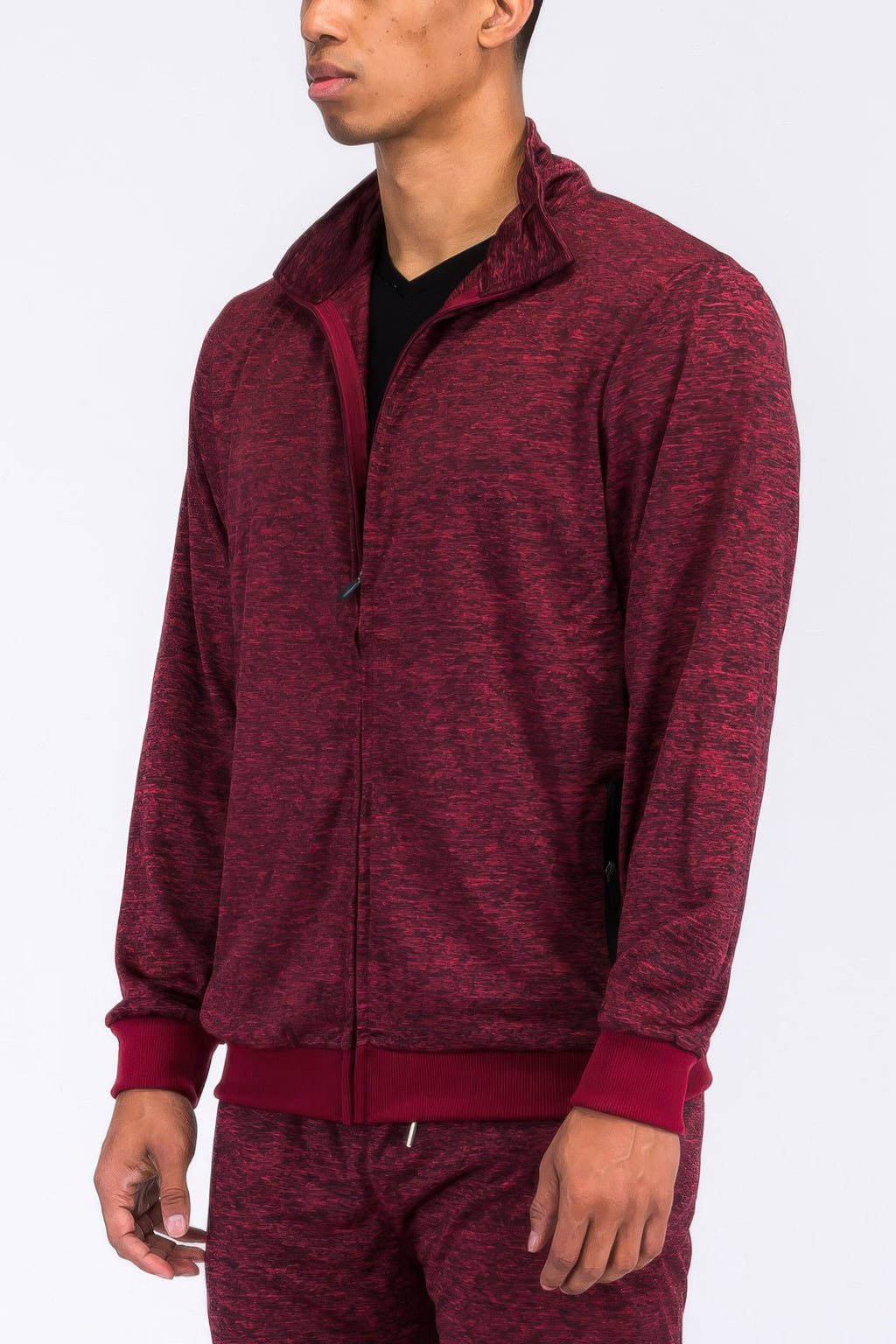 Burgundy marbled track jacket from the side view, half-zip and front pocket seams