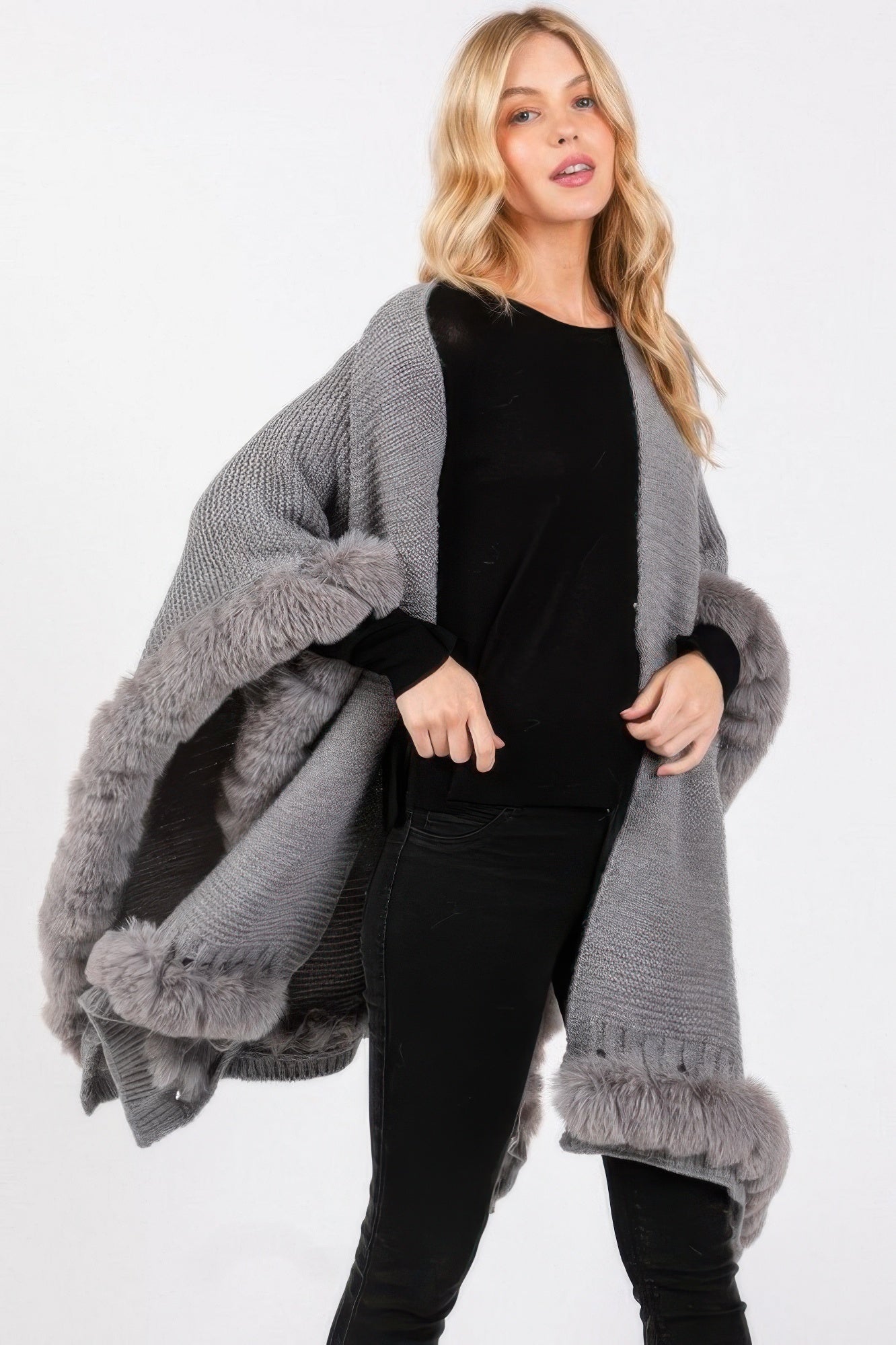 Gray knit-look cape with faux fur trim at cuffs and hem