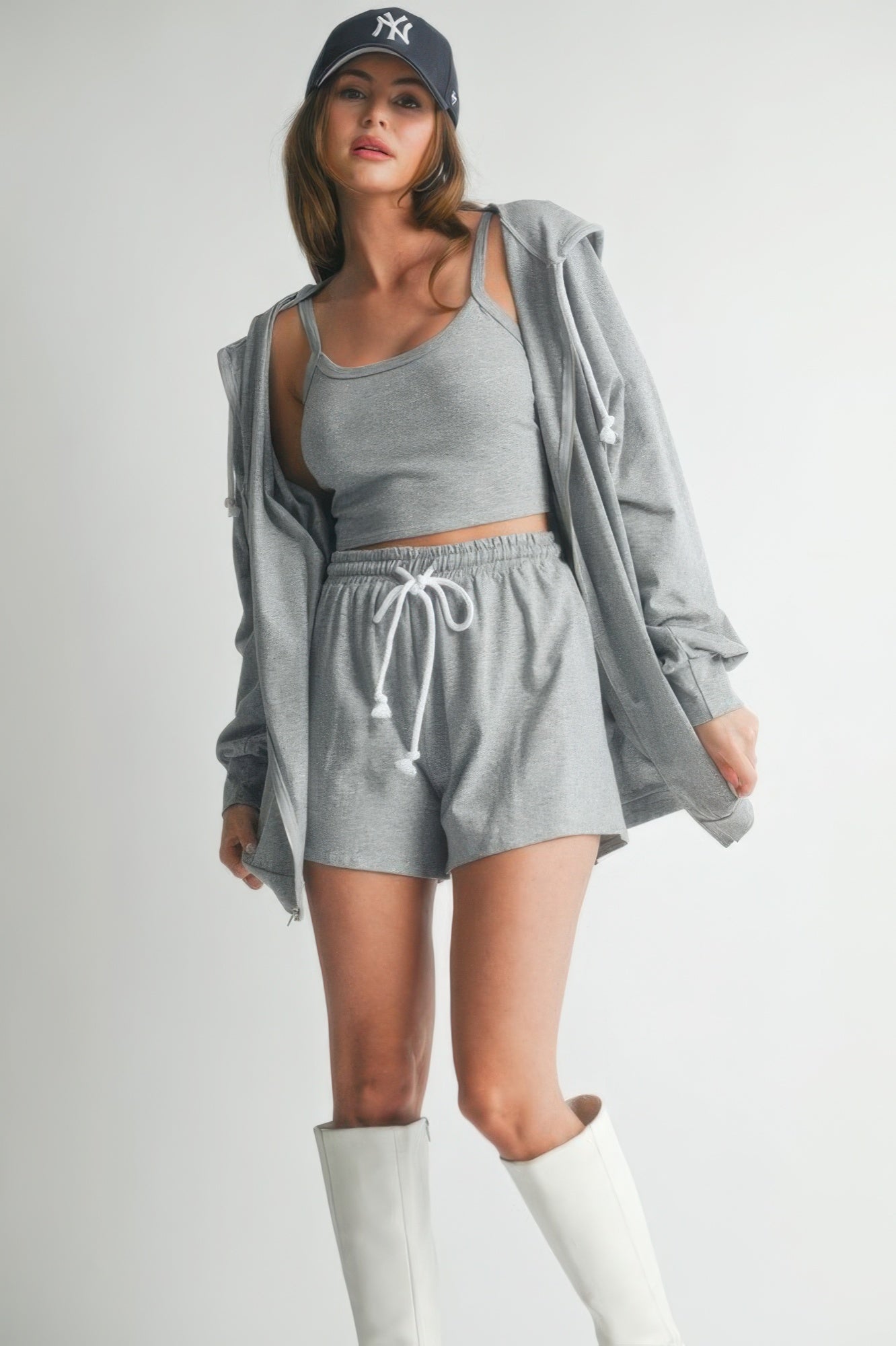 Heather grey zip hoodie with drawstring hem over cropped tank and shorts