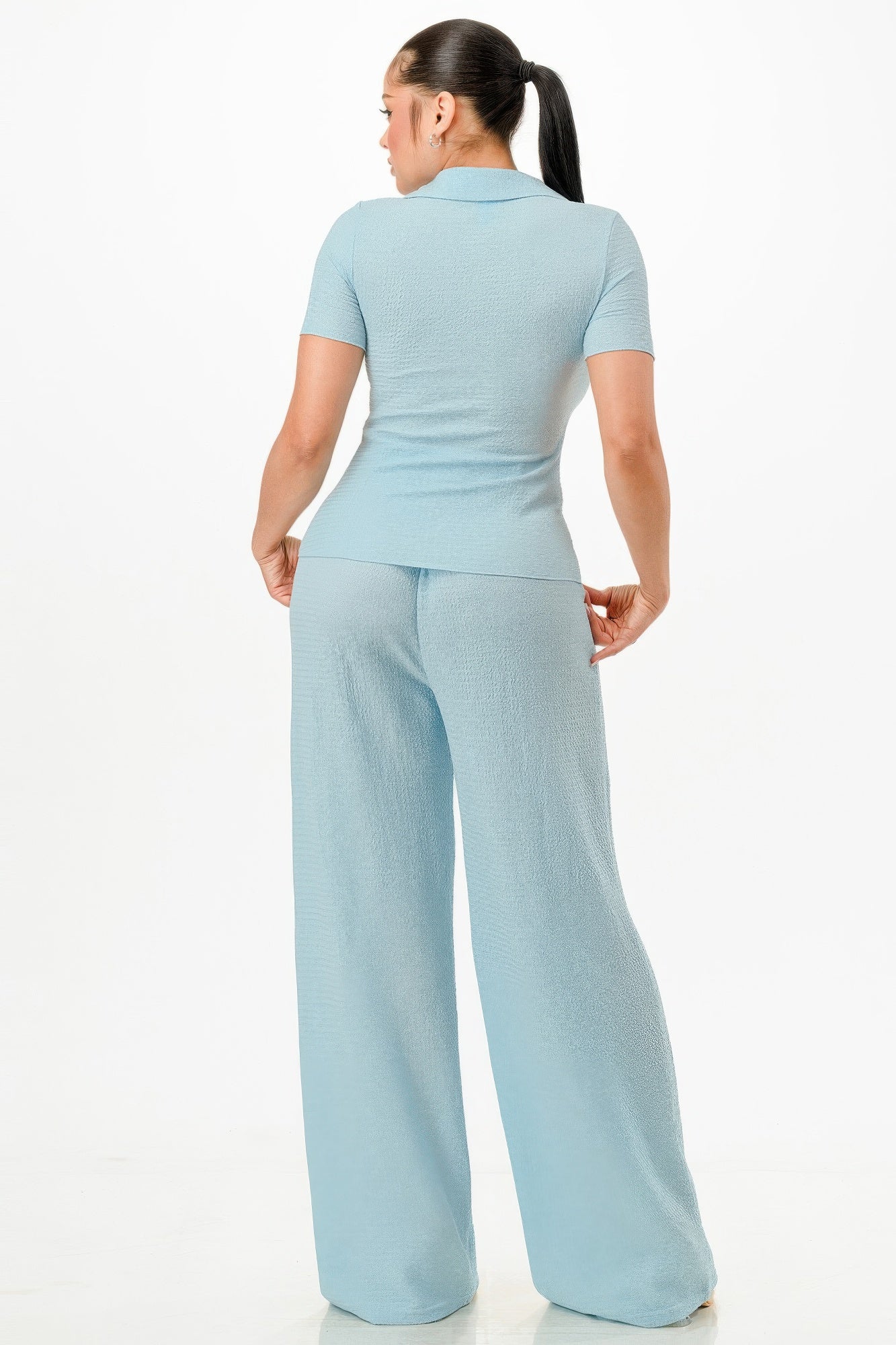 Blue textured polo top and wide-leg pants set, back view with relaxed fit