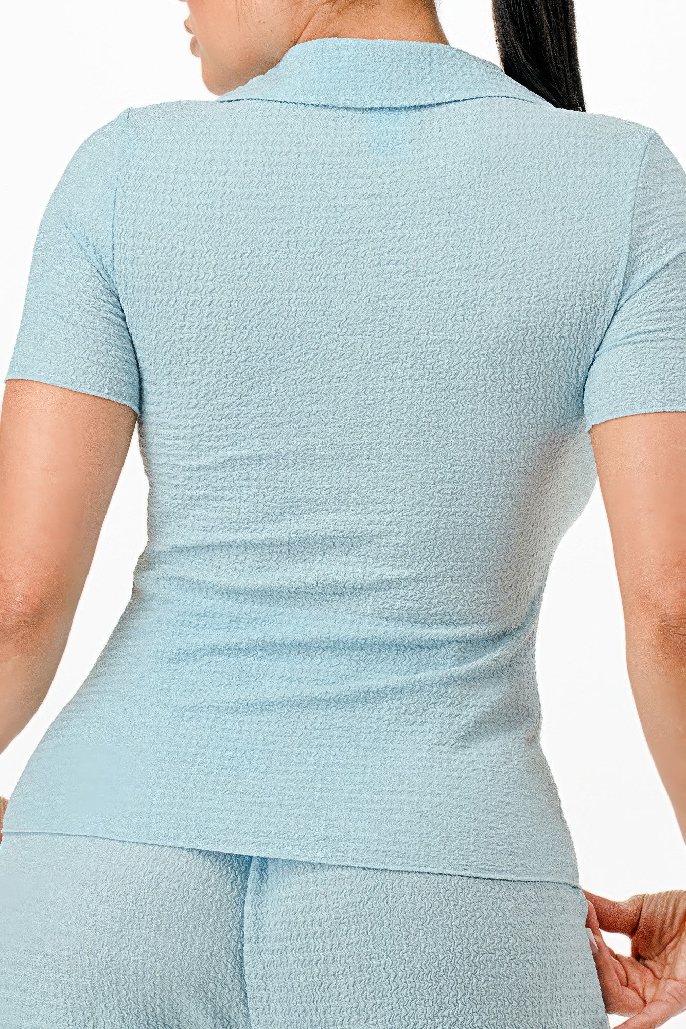 Back of blue textured polo top and matching wide-leg pants