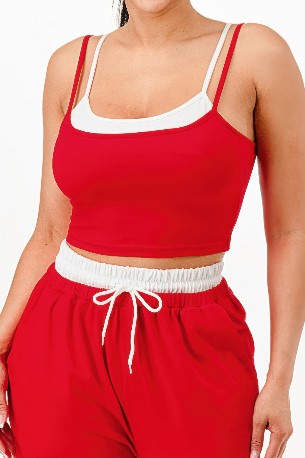 Red tank top with white trim; elastic sweatpants waistband with drawstring