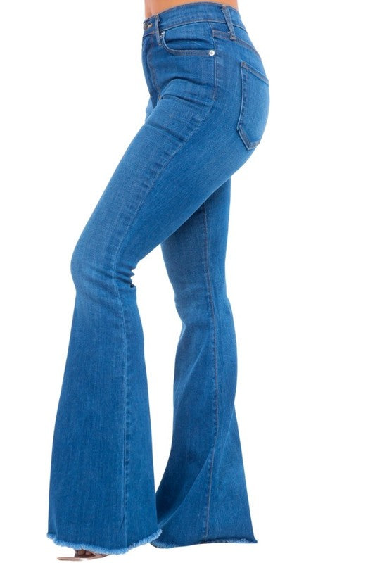 Medium-wash bell-bottom jeans, side view with flared leg and frayed hem