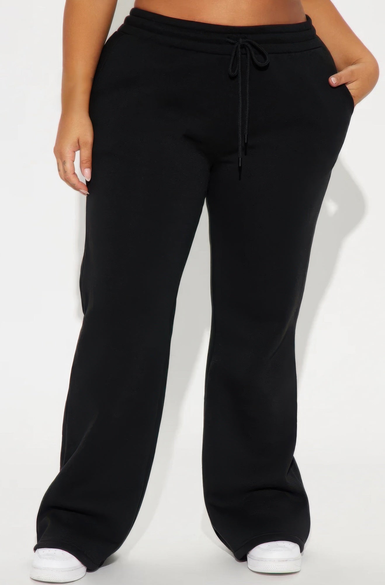 Black flared lounge pants with drawstring elastic waist, front view