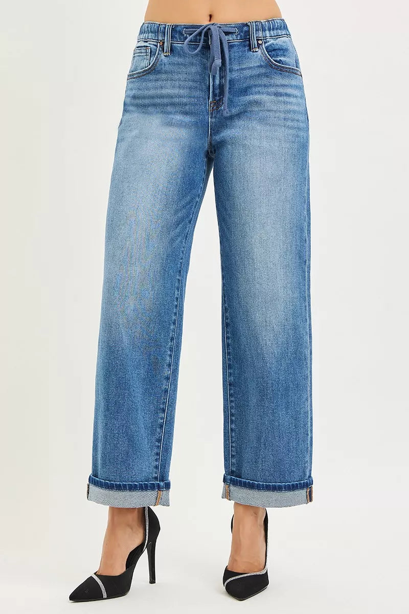 Front view medium-blue wide-leg jeans with cuffed hem and drawstring waistband
