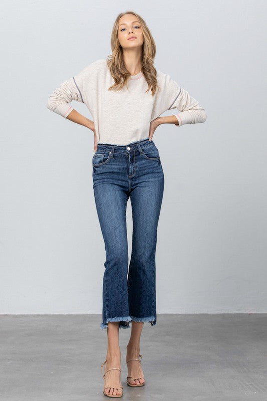 Dark blue bootcut jeans, frayed hem edge and classic five-pocket front