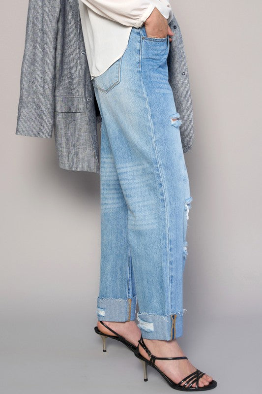 Medium wash high-waist ripped straight jeans with side seam detail and frayed hem tears.