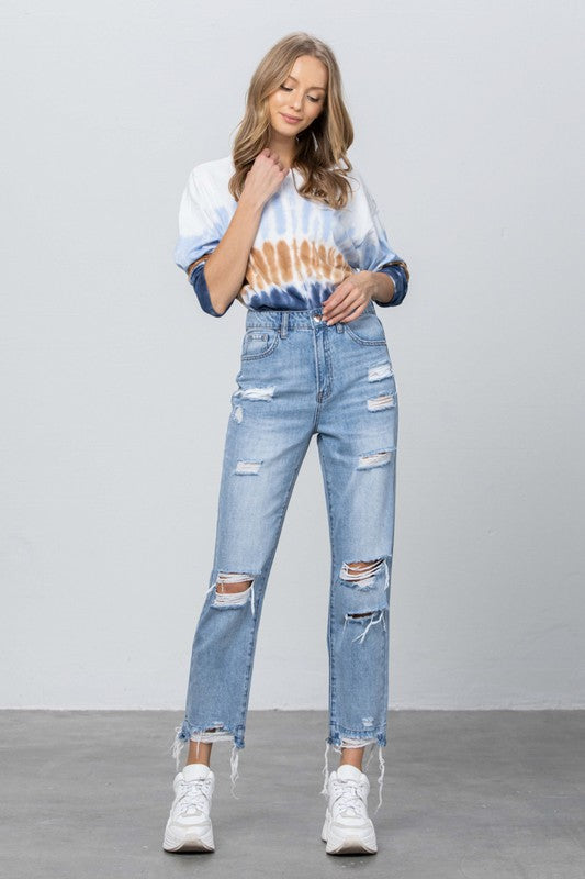 Medium wash high-waist ripped frayed girlfriend jeans with wide leg and ankle cuffs