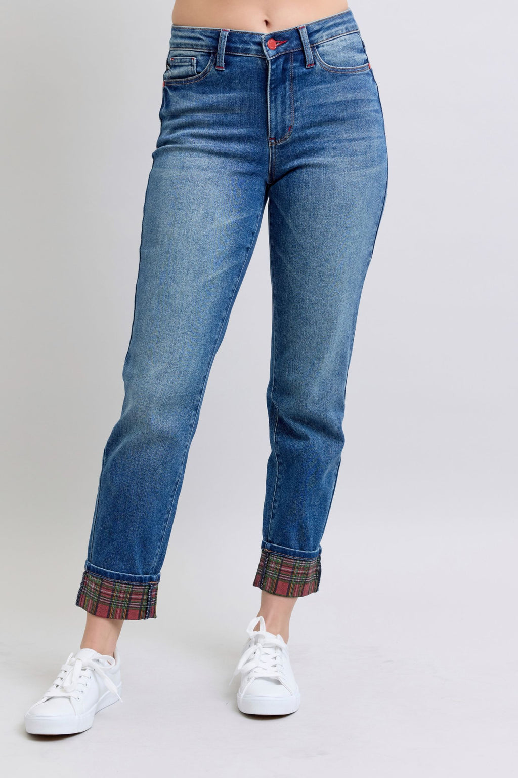Medium wash straight-leg jeans with plaid-trimmed cuffs and button closure