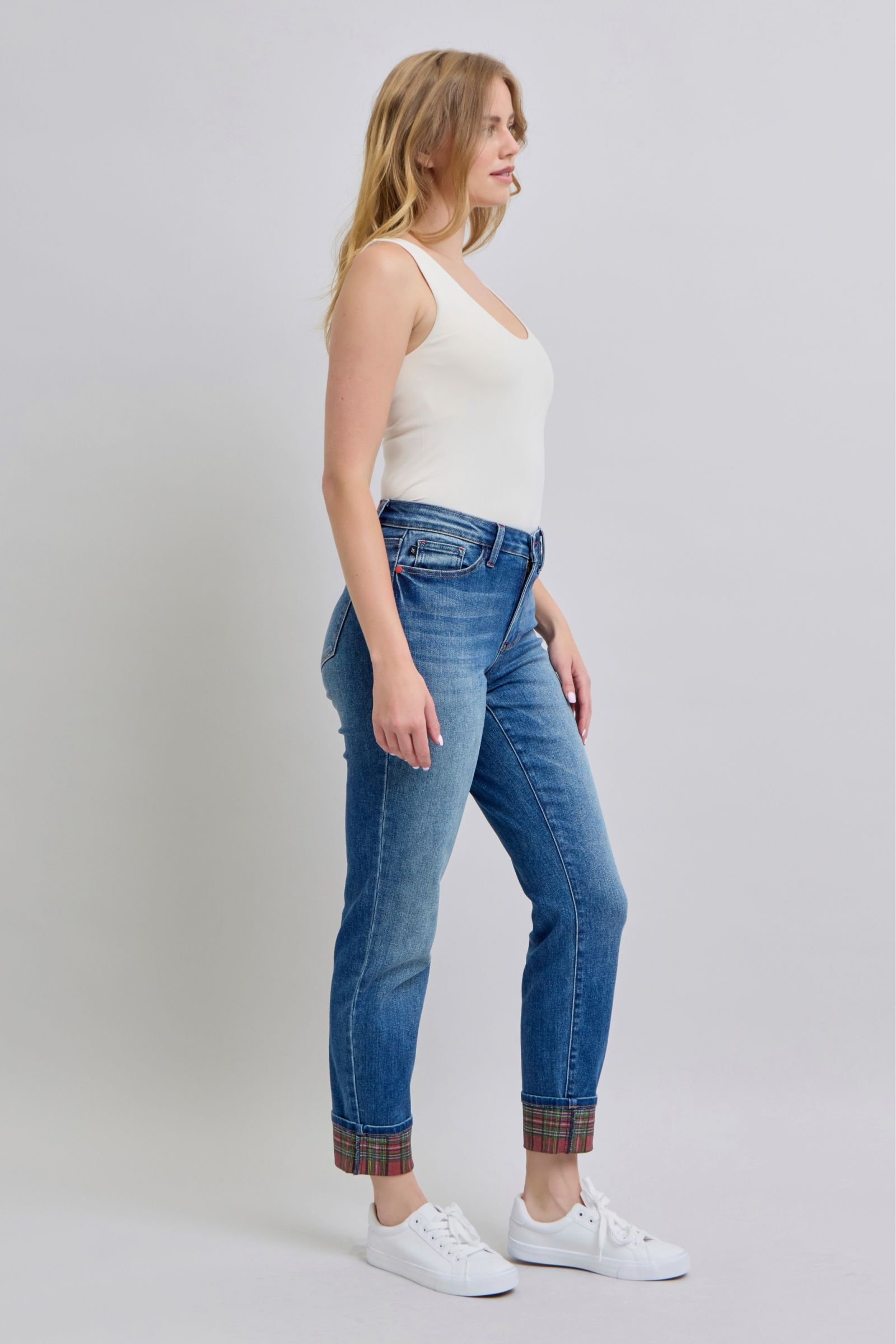 Straight-leg denim jeans with medium wash, plaid cuff hem, and front pockets