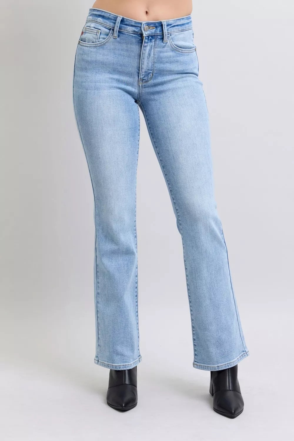 Light blue jeans with mid-rise waist and bootcut flared leg