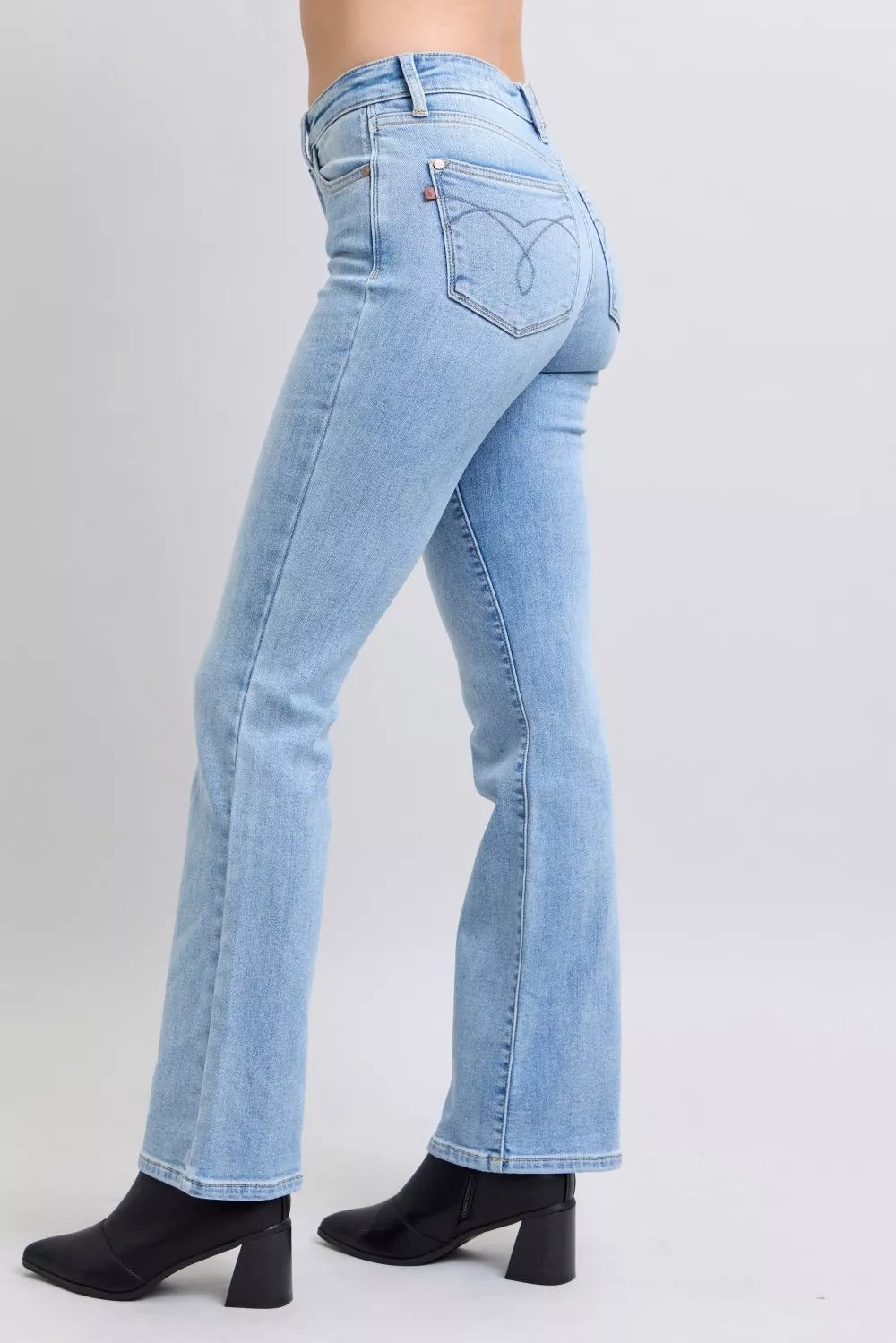 Light blue mid-rise bootcut jeans with back yoke and stitched pockets