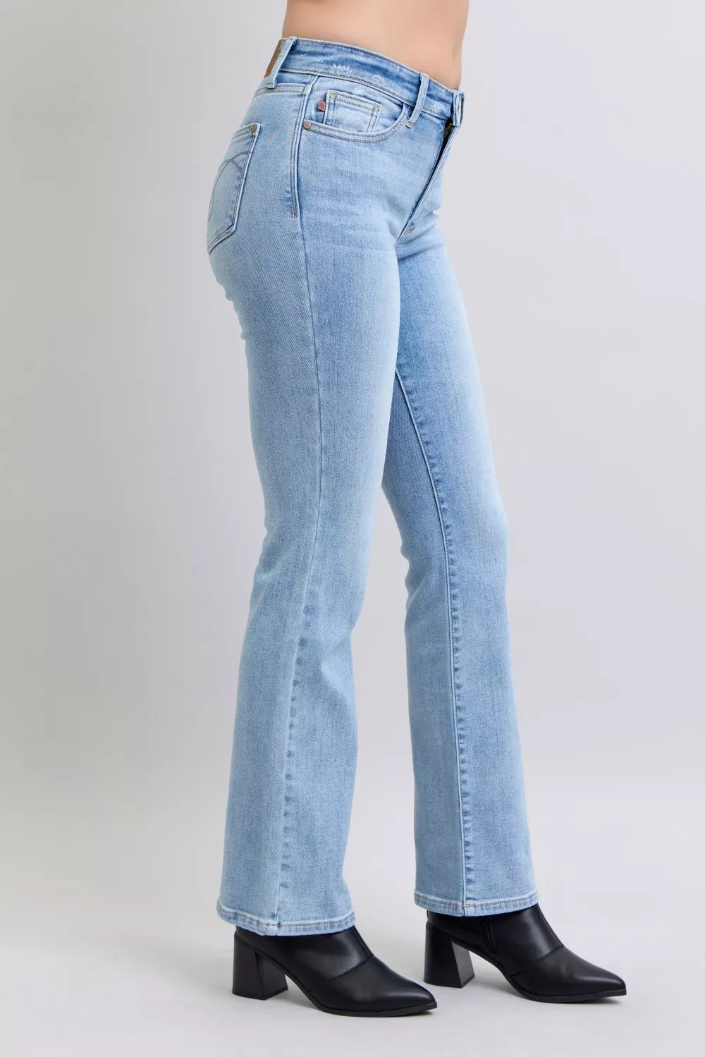Light blue bootcut denim jeans with back seams and belt loops