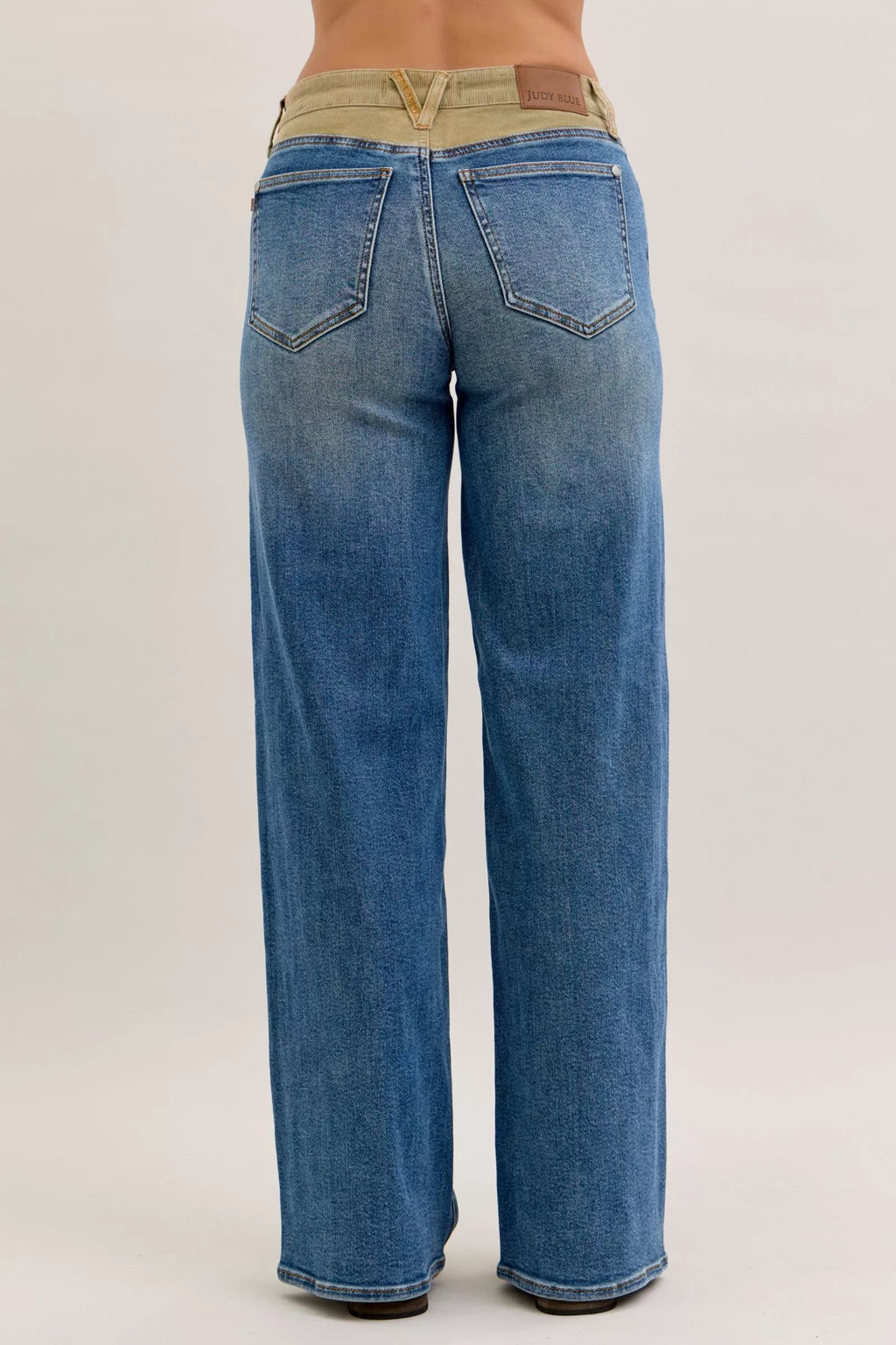 Judy Blue medium blue straight jeans, corduroy waistband, back view with pockets