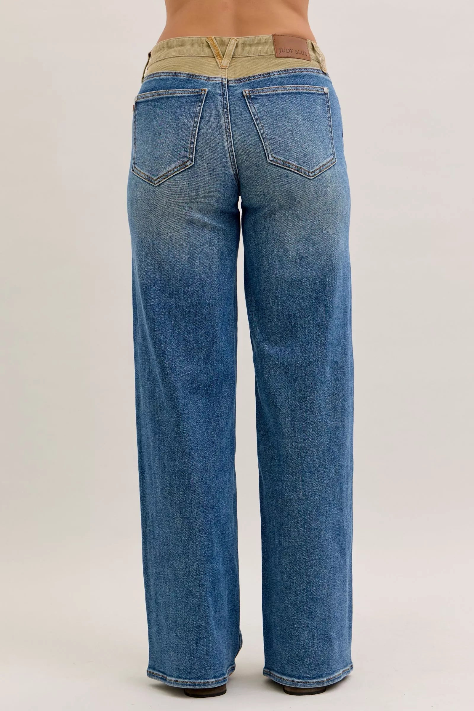Judy Blue medium blue straight jeans, corduroy waistband, back view with pockets