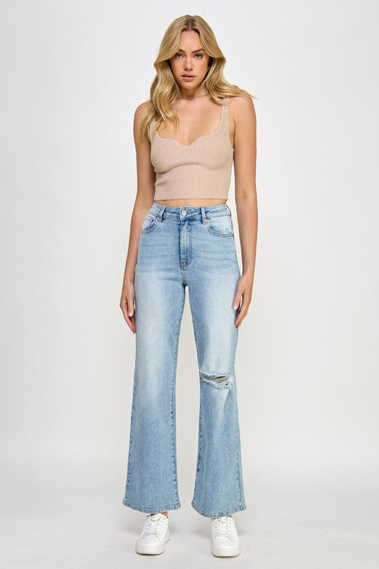 Light blue high-rise relaxed wide-leg jeans, ripped knee and wide flared leg opening
