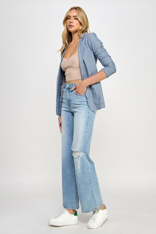 Light blue denim high-rise relaxed wide-leg jeans with ripped knee detail
