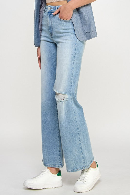 Light blue denim high-rise relaxed wide-leg jeans with hand pocket and side knee rip