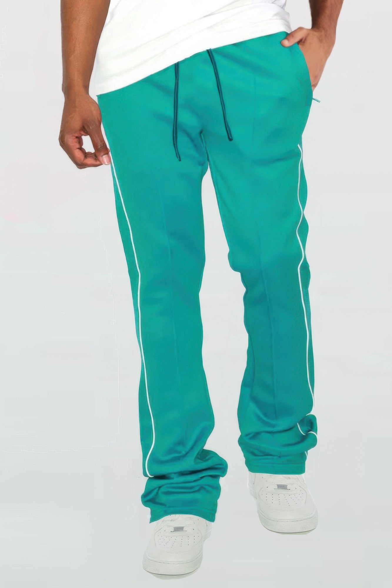 Teal stacked flare pants with white side piping and drawstring waistband
