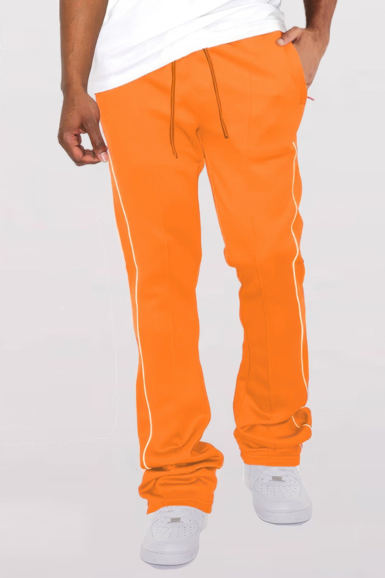 Orange stacked flare pants with white side piping and drawstring waist