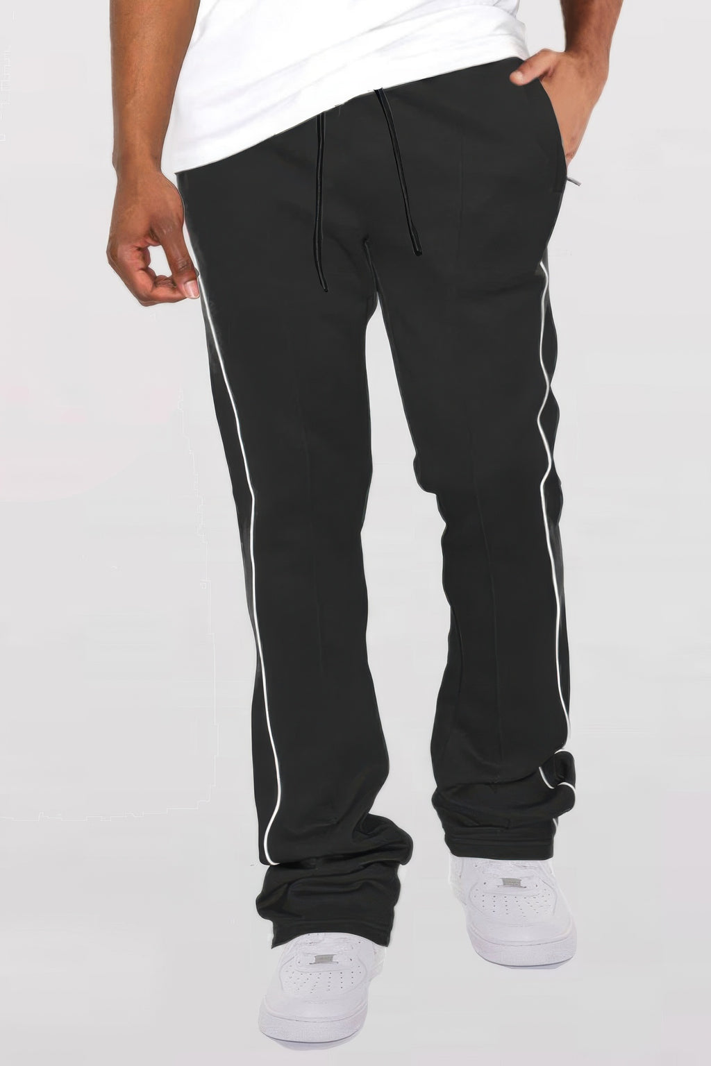 Black stacked flare pants with white side piping and elastic cuff detail