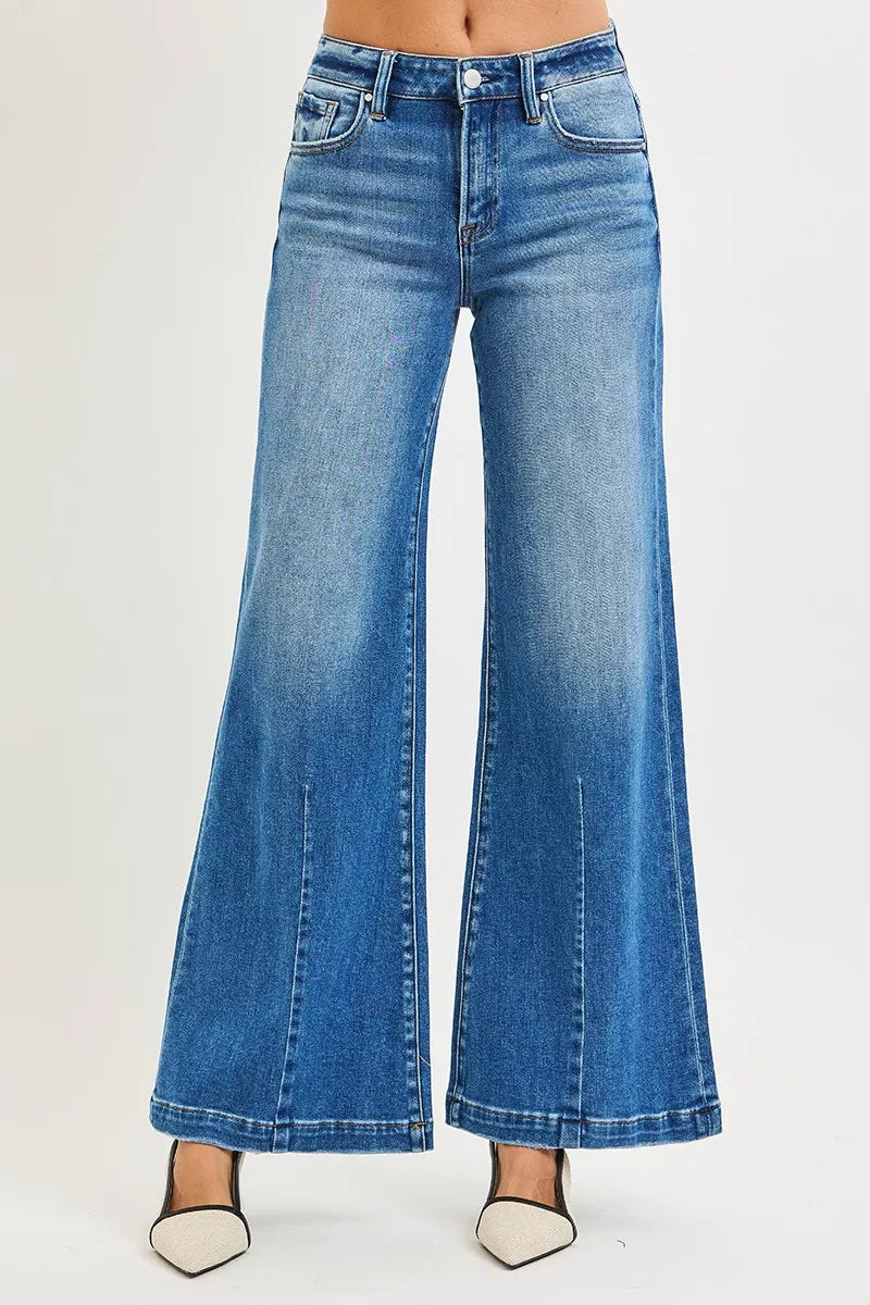 Blue mid-rise wide flared jeans, front view with belt loops and pockets