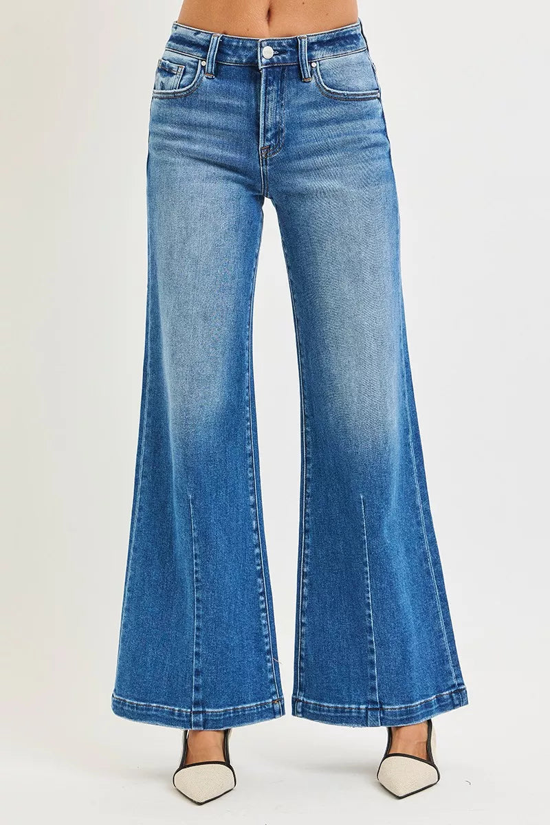 Blue mid-rise wide flared jeans, front close-up with button waist and pockets