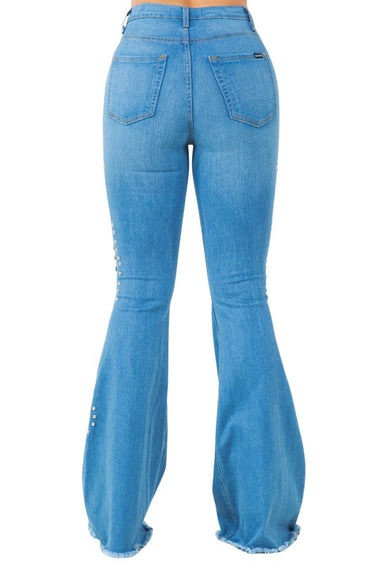 Medium-wash denim bell-bottoms, back view with patch pockets and rhinestone trim.