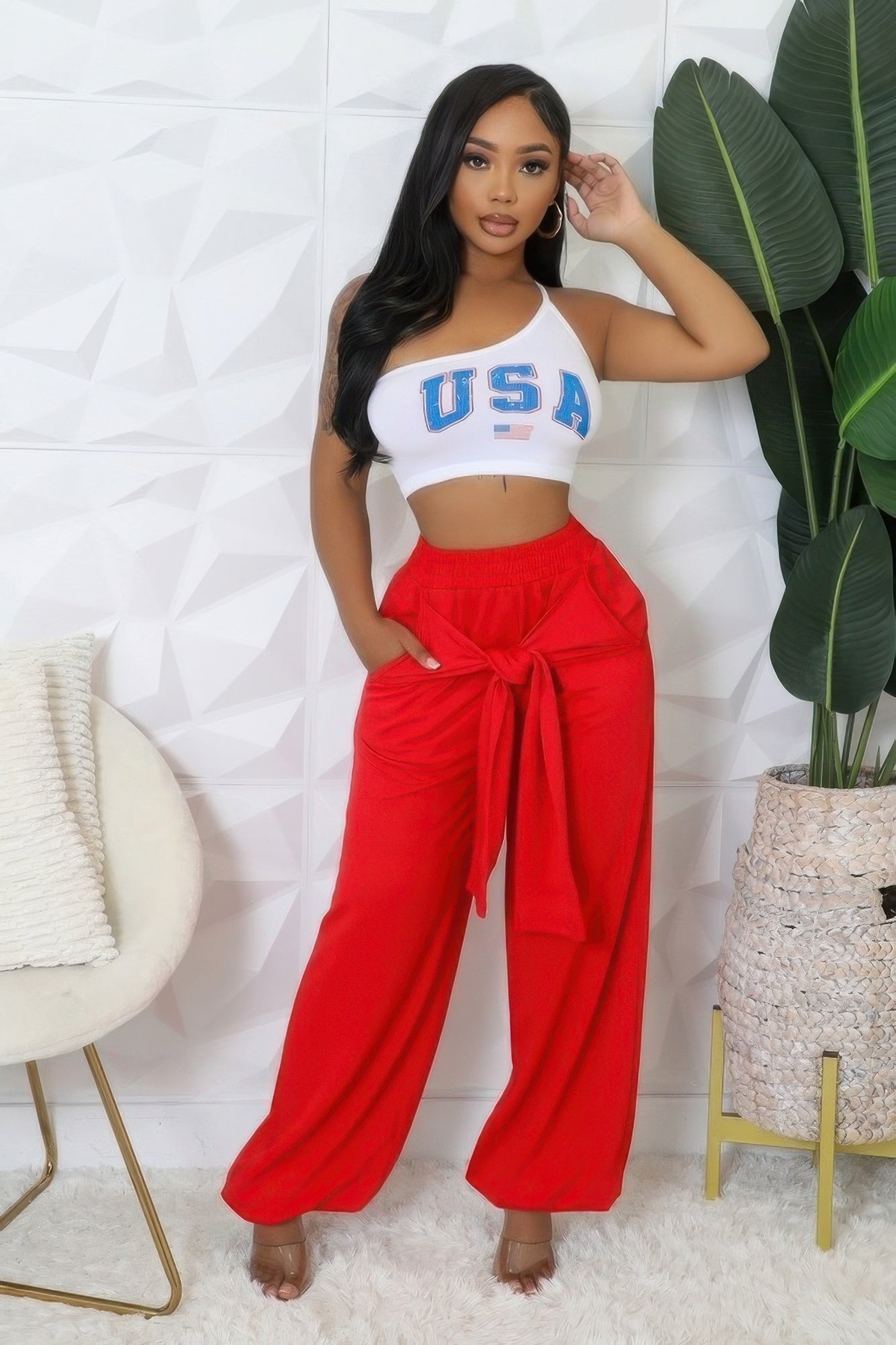 Red high-waist stretch pants with wide legs, tie-front detail and elastic waistband