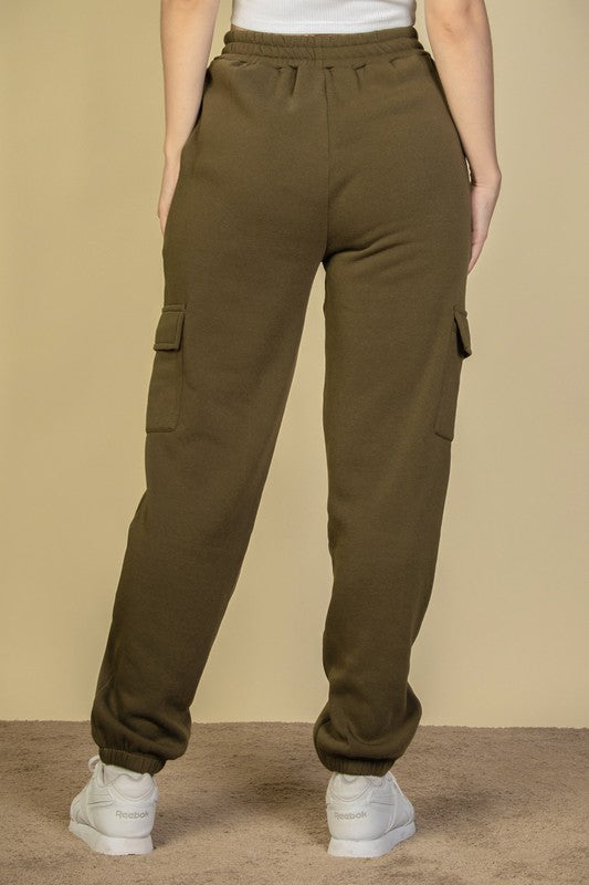 Olive sweatpants with side cargo pockets and elastic waistband, relaxed tapered leg