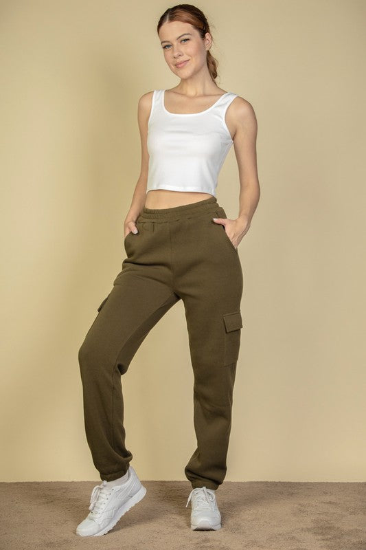 Olive cargo sweatpants with side pockets, drawstring waist, and cuffed hems